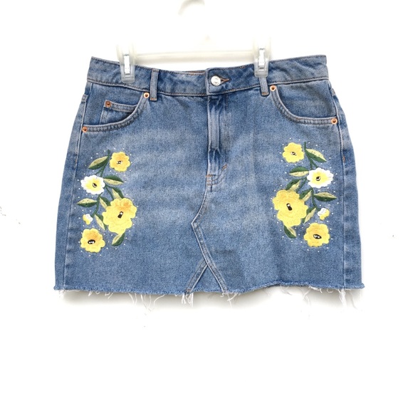 denim skirt with embroidered flowers